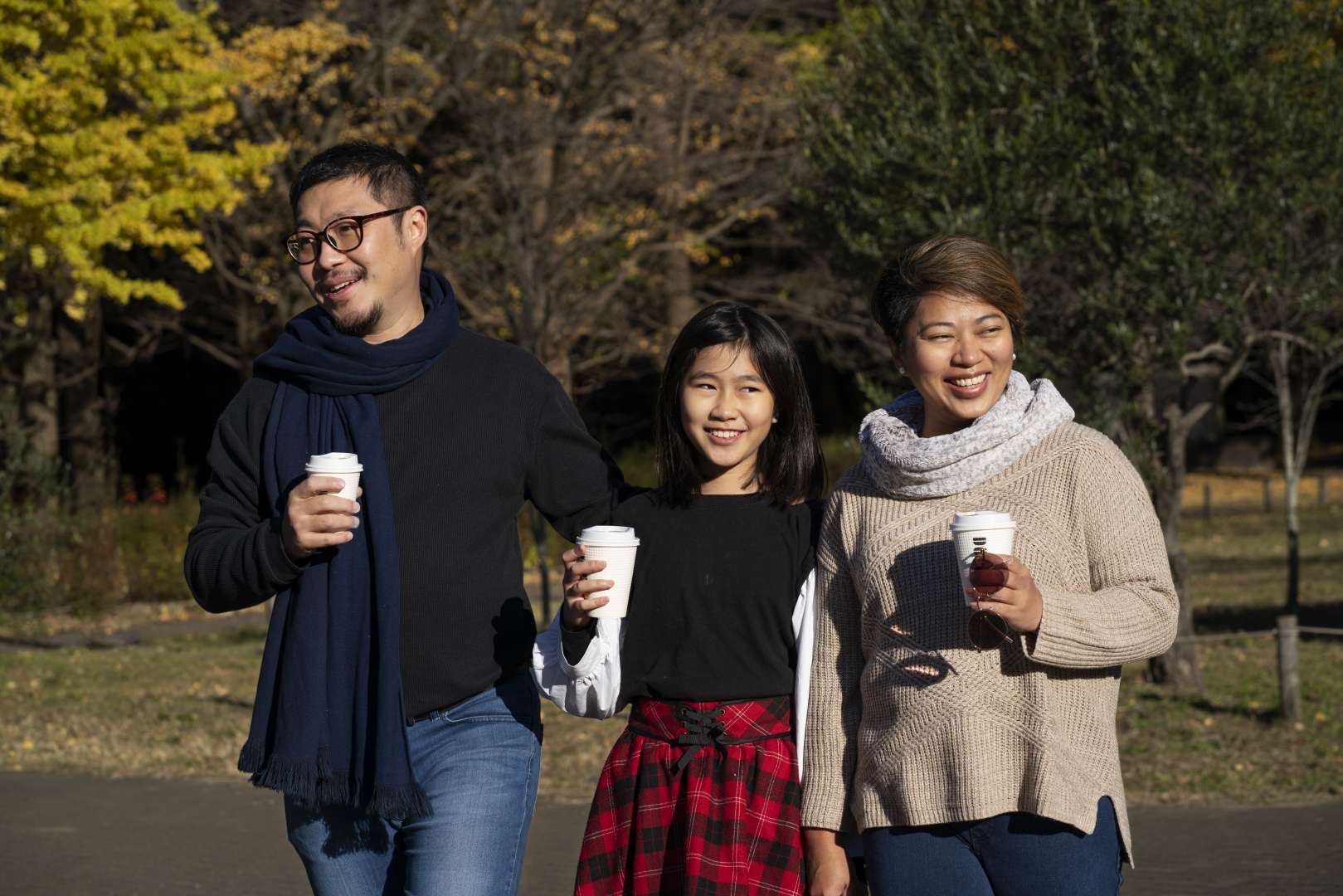 medium-shot-smiley-family-walking-together